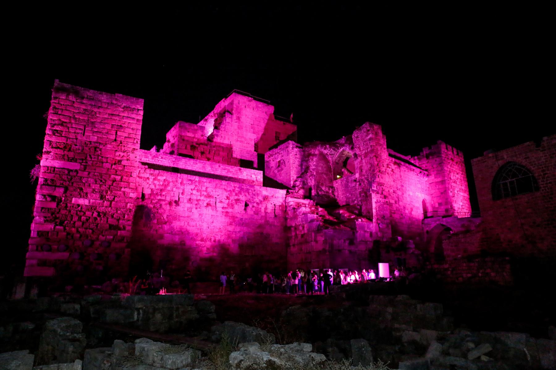 Byblos-Jbeil Castle at night, illuminated with pink lights