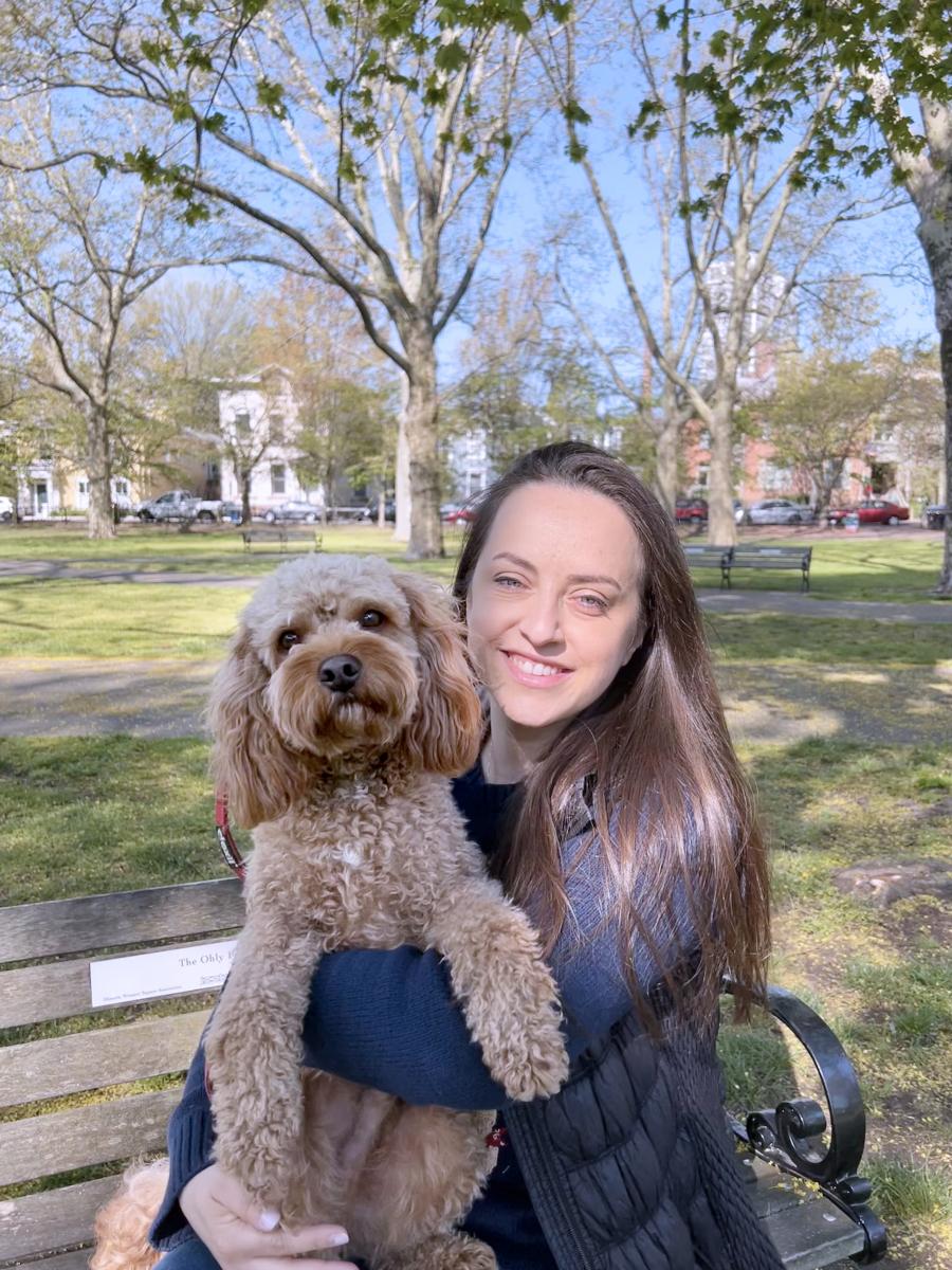 Dr. Nazli Dizman with her dog Chapkin in a park