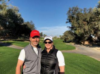 Dr. Weisberg golfing with her husband