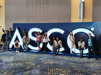 2023 IDEA recipients pose in front of the ASCO sign at the 2023 ASCO Annual Meeting