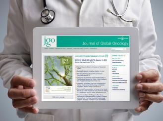 doctor holding tablet with JGO website