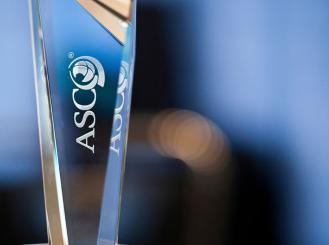 glass trophy with ASCO logo