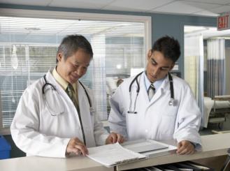 doctors look at a medical chart