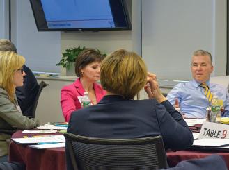 Photo of Research Community Forum Council Chair Michael A. Thompson, MD, PhD, engaging in a breakout session with Noelle Gaskill, MBA, Linda K. Dunklin, RN, and Laura M. Todt, RN, BSN, MPM.