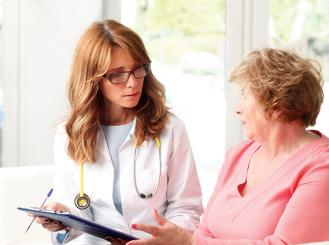 Stock image of doctor speaking to patient