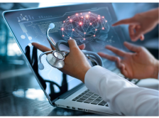Physician reviewing information on computer screen
