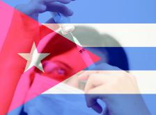 Healthcare professional behind a Cuban flag