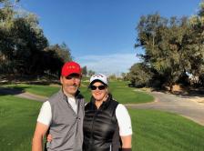 Dr. Weisberg golfing with her husband