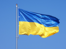 Ukraine flag against a blue sky